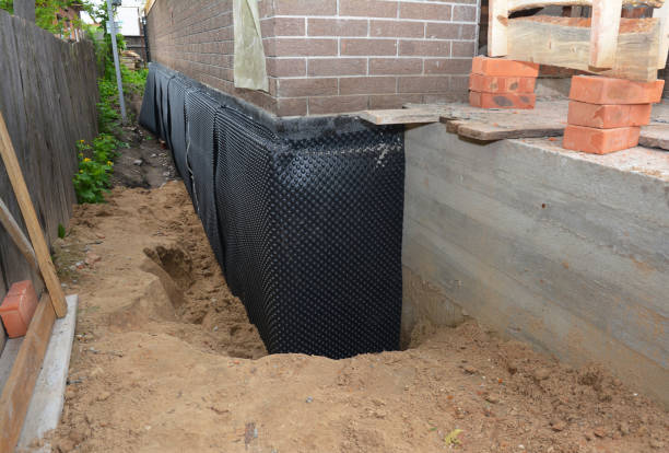SJ Waterproofing Pros technician performing targeted Emergency Waterproofing assessment in Dixon Springs, TN